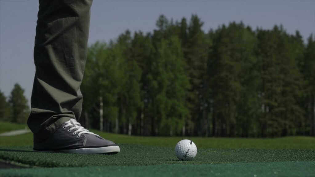 Man playing game of golf. Man hitting Golf ball