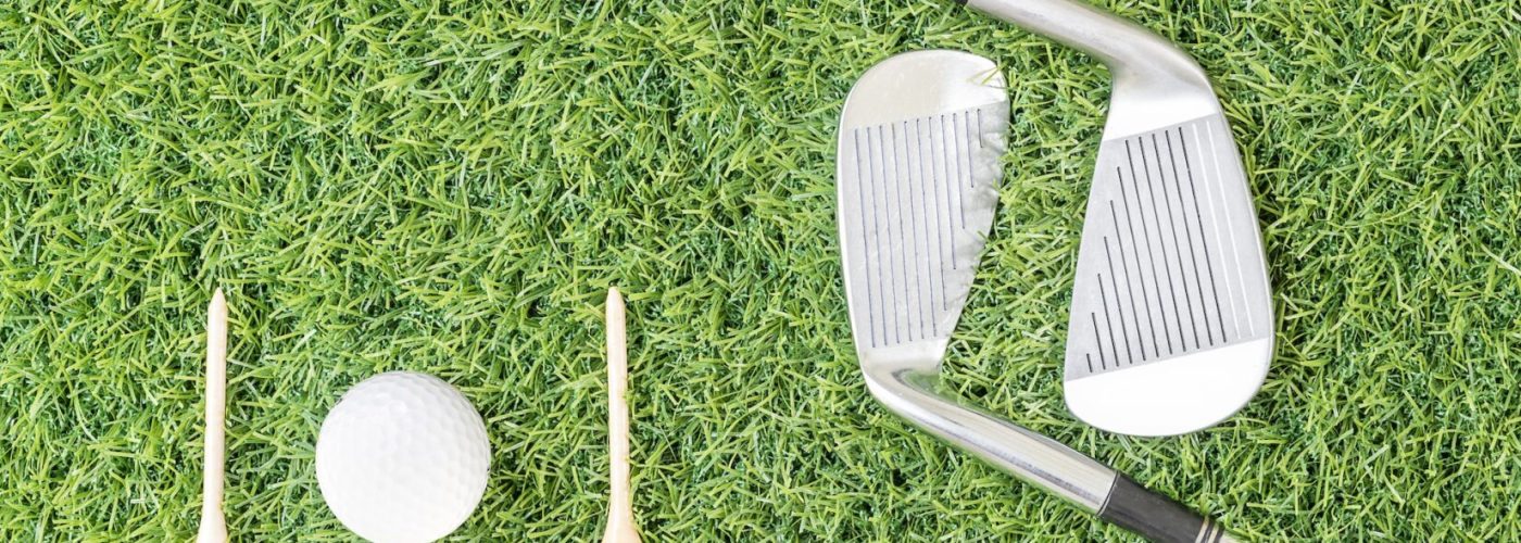 Golf club and golf ball on green grass-7